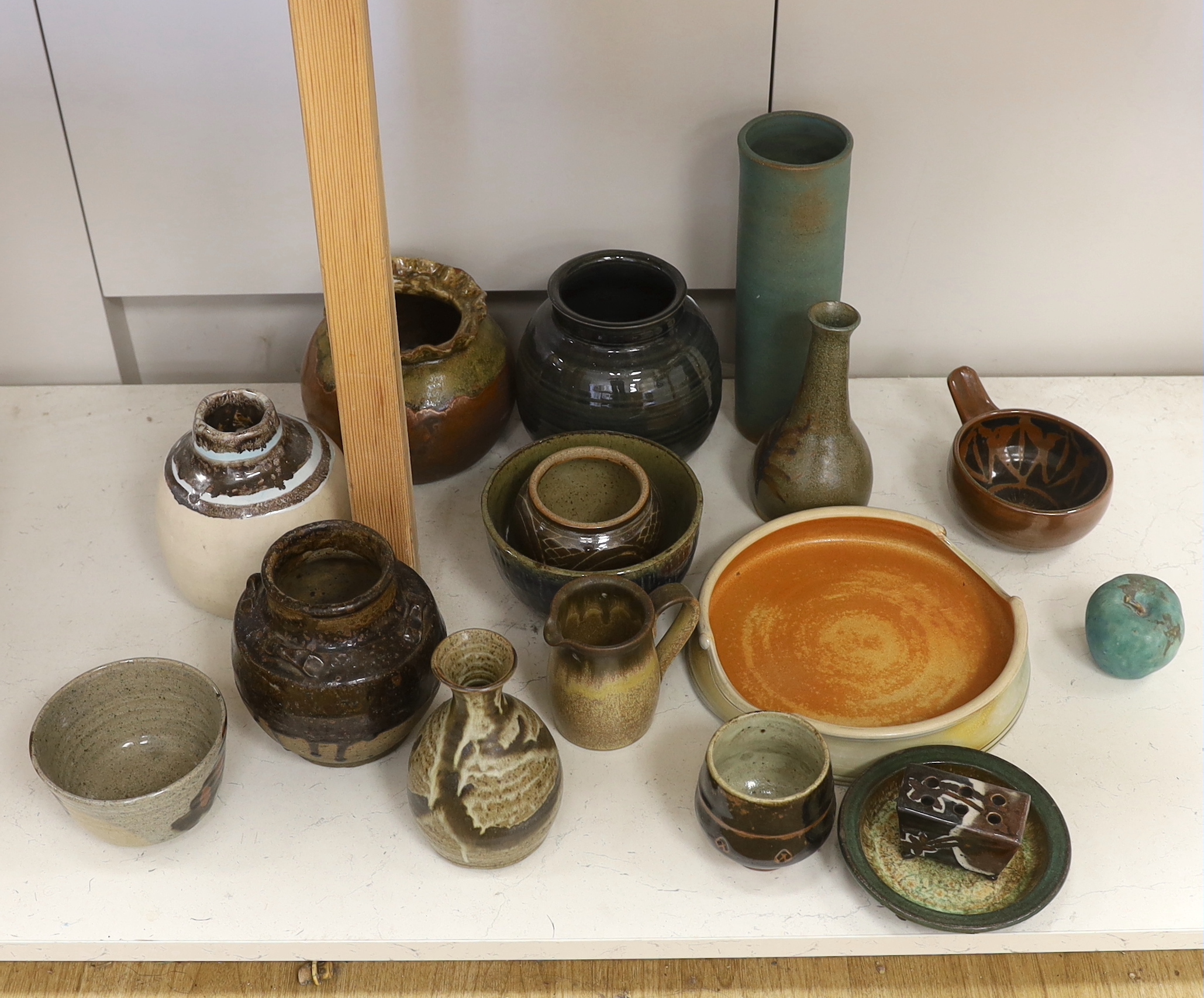 A large collection of mixed studio pottery vases, bowls and dishes